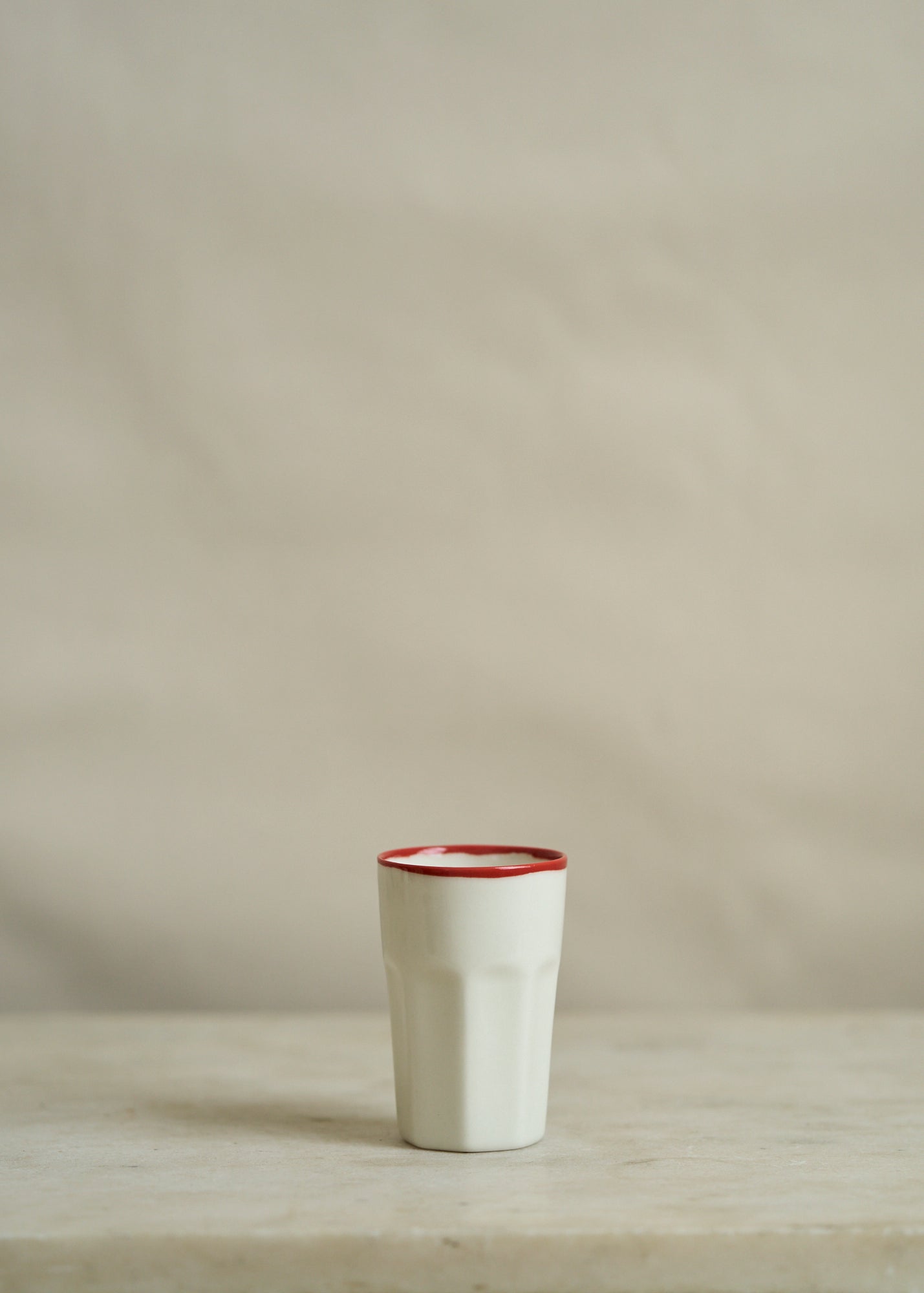 Porcelain Drinking Mug with Red Rim